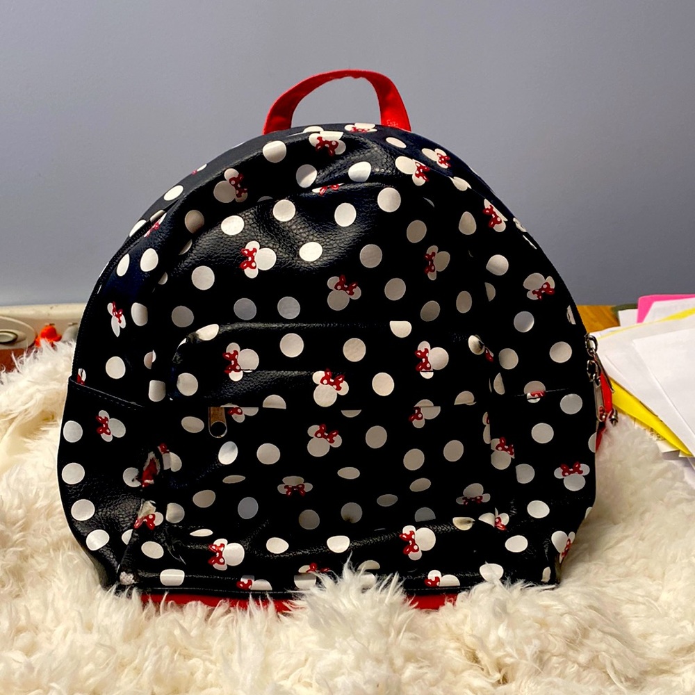 Cute Minnie Mouse mini backpack.  Purchased at Disney Orlando.  Gently used.